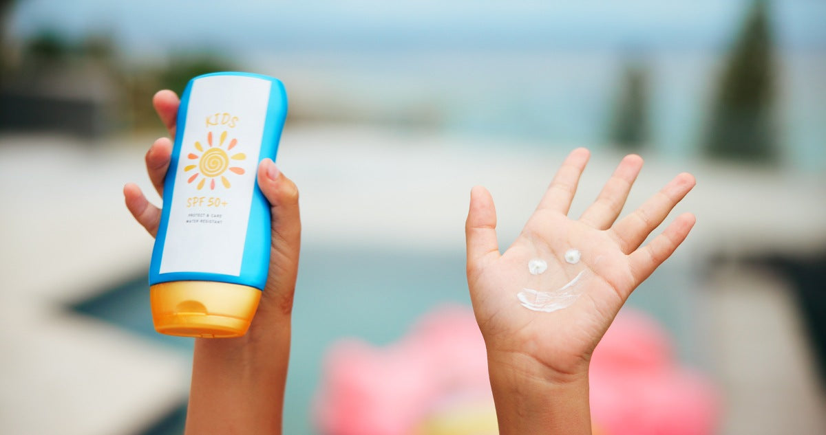 Sunscreen, smile drawing and hand with child at swimming pool for uv rays protection, spf cream or summer vacation